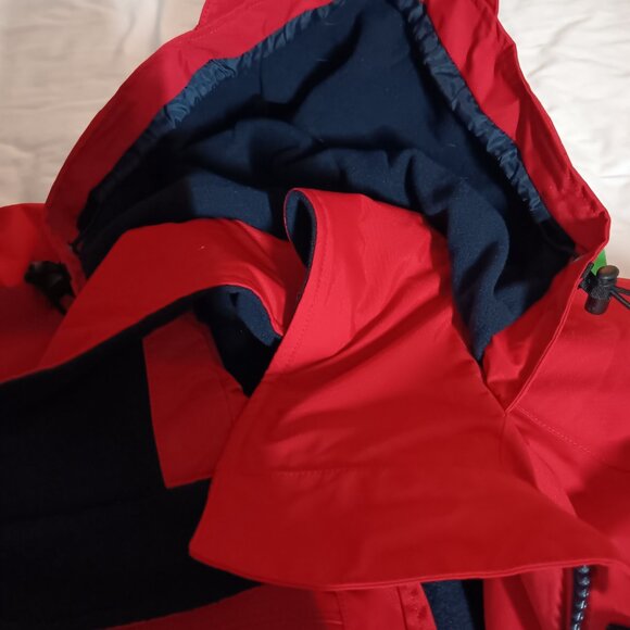 The iconic Abercrombie & Kent expedition red winter coat with blue lining. - Picture 3 of 10